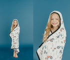 Girl wearing Copper Pearl Big Kid Knit Hooded Towel -Farm- Available at www.tenlittle.com