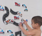 Boy playing on the wall Edushape Bath Foam Toys - Wheels - Available at www.tenlittle.com