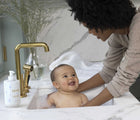 Mom Bathing in sink and using EllaOla Superfood Baby Shampoo & Body Wash - Available at www.tenlittle.com