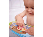 Boy bathing and playing HABA Color changing bath book - farm animals - available at www.tenlittle.com