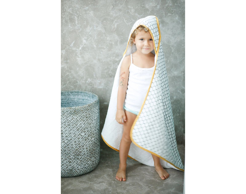 https://tenlittle.com/cdn/shop/files/Ten-Little-Kids-Bath-Body-Malabar-Baby-Hooded-Block-Print-Towel-Yellow3_800x.jpg?v=1692135440