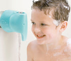 Boy at the shower with Puj Faucet Spout Cover- Available at www.tenlittle.com