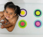 Kid at the bath tub with Puj Grippy Bath Treads Info- Available at www.tenlittle.com