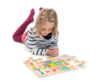 Girl playing with Tender Leaf Alphabet Tray - Available at www.tenlittle.com