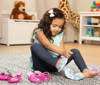 Girl sitting in a carpet wearing Melissa & Doug Dress up Shoes- Blue - Available at www.tenlittle.com