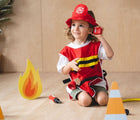 Girl playing and wearing Plan Toys Firefighter Play Set - Available at www.tenllittle.com