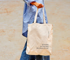 Adult holding the Ten Little Parent on Duty Tote. Available from www.tenlittle.com