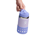 Person utilizing finger loop of the Hydro Flask 12 oz Stainless Steel Straw Lid Water Bottle in purple. Available from www.tenlittle.com