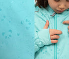 Close up printed designs when wet - Therm SplashMagic Eco Fleece Rain Jacket - Aqua - Available at www.tenlittle.com