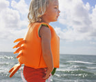 Child wearing the Sunnylife Sea Creature Float Vest (Ages 2-3) - Crab. Available from www.tenlittle.com