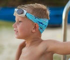 Boy wearing Splash Place Shark Tangle-Free Swim Goggles. Available from www.tenlittle.com