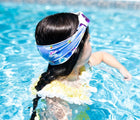 Child in pool with Splash Place Unicorn Tangle-Free Swim Goggles. Available from www.tenlittle.com