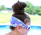 Child wearing Splash Place Unicorn Tangle-Free Swim Goggles. Available from www.tenlittle.com