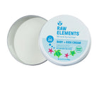 Raw Elements Baby & Kids Sunscreen Tin opened showing balm inside. Available from www.tenlittle.com