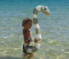 Child swimming with the Sunnylife Snake Pool Noodles - Set of 2. Available from www.tenlittle.com