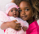 Child Holding Adora Adoption Baby Bundle Joy - Available at www.tenlittle.com