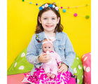 Little Girl Holding Adora PlayTime Baby Doll - Llama Pajama Info - Available at www.tenlittle.com