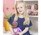 Little Girl Holding Adora Playtime Baby Doll - Purple Dreams - Available at www.tenlittle.com