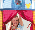 Girl inside the HABA Doorway Puppet Theater - Available at www.tenlittle.com
