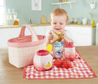 Baby playing with Hape Picnic Playset - Available at www.tenlittle.com