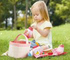 Girl playing with Hape Picnic Playset - Available at www.tenlittle.com