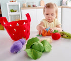 Baby playing with Hape Fabric Vegetable Basket - Available at www.tenlittle.com