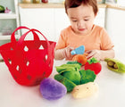 Baby slicing carrots - Hape Fabric Vegetable Basket - Available at www.tenlittle.com