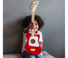 Kid holding Loog Mini Acoustic Guitar - Red - Available at www.tenlittle.com