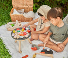 Kids on picnic and playing with Plan Toys BBQ Playlet - Available at www.tenlittle.com