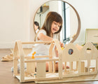 Girl playing Plan Toys Slide N Go Dollhouse & Accessories -Available at www.tenlittle.com