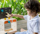 Boy playing Plan Toys Workbench with tools - Available at www.tenlittle.com