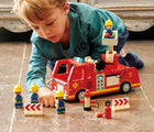 Close up boy playing Tender Leaf Fire Engine with Accessories - Available at www.tenlittle.com