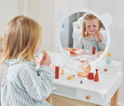 Girl playing make up using Tender Leaf Forest Dressing Table - Available at www.tenlittle.com