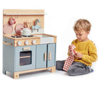 Boy playing with Tender Leaf Home Kitchen with Accessories - Available at www.tenlittle.com