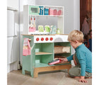 Boy Playing with the Tender Leaf Kitchen Range with Accessories - Available at www.tenlittle.com