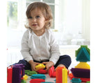 Child playing with Edushape Young Brix. Available from www.tenlittle.com.
