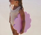 Child holding the Sunnylife Mermaid Kickboard. Available from www.tenlittle.com