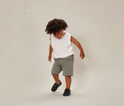 Boy wearing Ten Little Everyday Original - All Black. Available from www.tenlittle.com