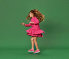 Girl dancing and wearing Limited Edition Everyday Original x2 in Pink and Yellow. APMA approved. Available at www.tenlittle.com