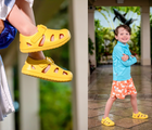 Split view of child wearing Ten Little Splash Sandals in Daisy Yellow. Available from www.tenlittle.com