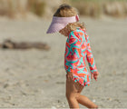 Child at the beach in the Snapper Rock One piece UPF 50+ Swimsuit - Geo Melon. Available from www.tenlittle.com