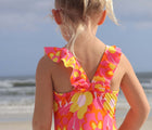 Closeup of back view of child wearing the Snapper Rock UPF 50+ Swim Shorts - Flowers. Available from www.tenlittle.com