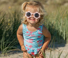 Child wearing the Snapper Rock UPF 50+ Swimsuit - Lighthouse Island. Available from www.tenlittle.com