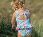 Child showcasing the back of the Snapper Rock UPF 50+ Swimsuit - Lighthouse Island. Available from www.tenlittle.com