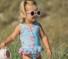 Child wearing the Snapper Rock UPF 50+ Swimsuit - Lighthouse Island. Available from www.tenlittle.com