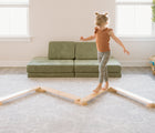 Child walking on Piccalio Wooden Balance Beam. Available from www.tenlittle.com