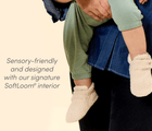 Parent holding child wearing Ten Little Sherpa Baby Booties - sensory-friendly and designed with our signature SoftLoom® interior. Available at www.tenlittle.com
