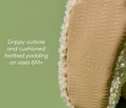 Close-up of grippy outsole and cushioned footbed padding on sizes 6M+ of Ten Little Sherpa Baby Booties. Available at www.tenlittle.com