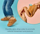 Split view of child wearing Ten Little Cozy Suede Sneakers and person flexing zero-drop sole which promotes natural movement and posture - Toffee Brown. Available at www.tenlittle.com