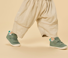 Side view child wearing Ten Little DuoKnit Sneakers - Agave Green. Available at www.tenlittle.com
